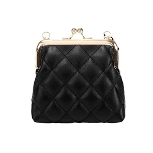 Chic black quilted mini crossbody bag with golden kiss-lock and classic leather texture