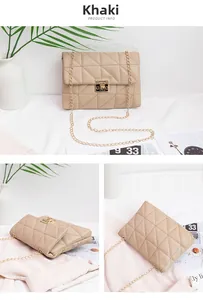 Detail of khaki quilted crossbody bag with golden square lock and chain strap