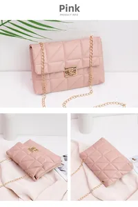 Close-up of pink quilted crossbody bag with gold square lock and chain strap