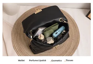 Interior view showing the large capacity of a black quilted crossbody bag with items