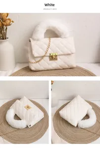 Detail view of white quilted crossbody bag with fluffy faux fur handle and gold metal lock