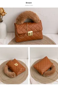 Detailed view of brown quilted bag with faux fur handle and golden chain strap