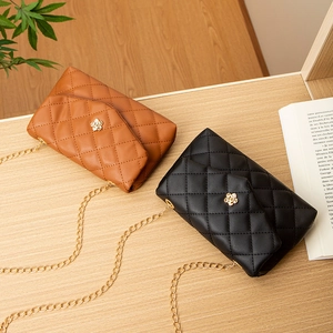 Quilted crossbody bags in black and brown with floral gold locks and chain straps