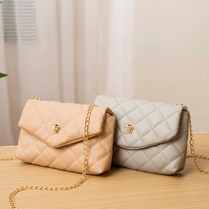 Quilted crossbody phone bags with floral gold buckles and metal chain straps