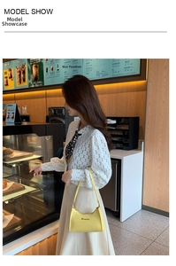 Chic yellow crocodile pattern hobo bag styled with a white lace shirt in a cafe setting