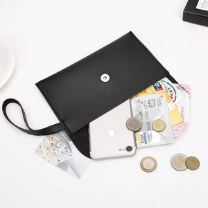 Black Nappa texture envelope clutch bag with wrist strap holding smartphone and cards