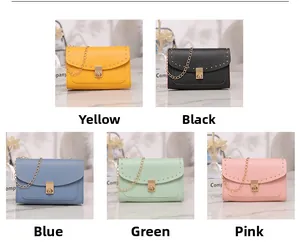 Detail view of colorful cross-body bags with gold stud trim and rotating square lock