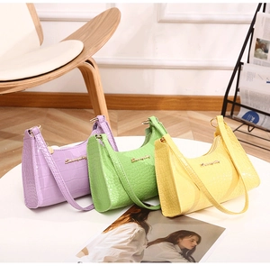 Chic croc-embossed hobo bags in lavender, lime, and yellow with gold logo details