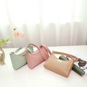 Three minimalist checkered shoulder bags in mint green, pastel pink, and beige colors