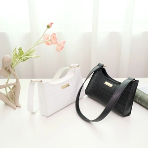 Minimalist plaid patterned underarm handbags in black and white with gold accents