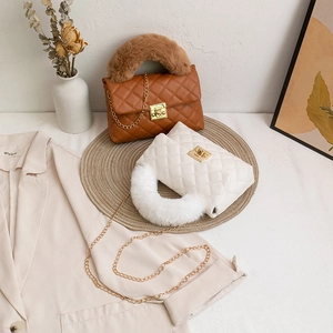 Quilted crossbody bag with plush handle and gold chain in brown and off-white