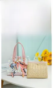 Detail of transparent TPU tote with daisy print, pink handle and straw insert bag