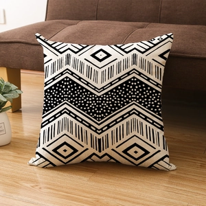 Square black and white geometric pattern pillowcase in a cozy home setting decor