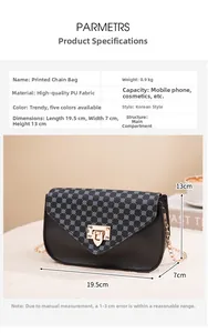 Detail view of black PU leather crossbody bag with vintage floral print and gold metal chain