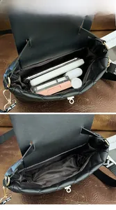 Detail view of the large capacity interior of a quilted black crossbody bucket bag