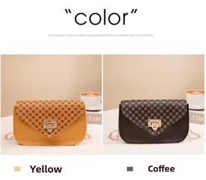 Detail of crossbody bag with metal square lock, gold chain strap and geometric print
