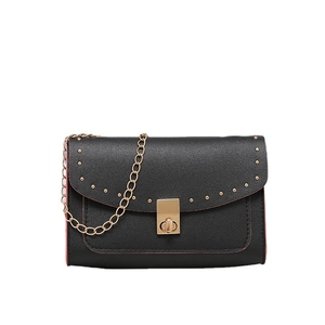 Classic black flap crossbody bag with gold stud trim and chain strap on white backdrop