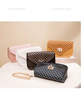 Detailed scene show of assorted mini crossbody bags with retro patterns and gold chain