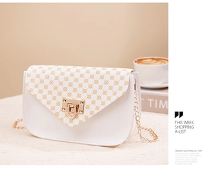Close-up of a white leather crossbody phone bag with V-shaped flap and gold chain strap
