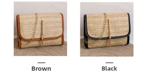 Detail of woven straw envelope bags with tassel lock and chain strap in brown and black
