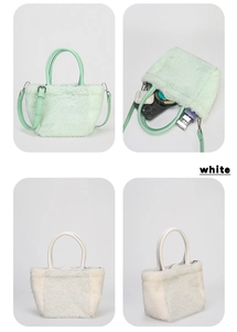 Detailed view of plush quilted mini handbags in mint green and white with shoulder straps
