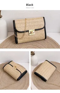 Close-up detail of a woven straw small bag with black leather trim and gold metal lock