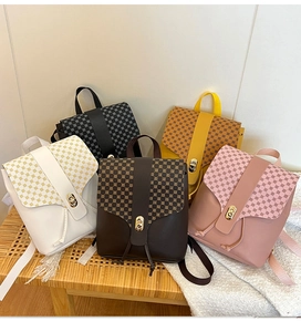 Detailed row of five mini PU leather backpacks in multi-color with geometric print