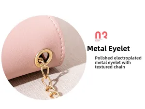 Detail of pink PU leather texture with gold metal eyelet and polished chain strap