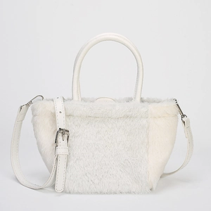 Minimalist white faux fur crossbody bag with quilted handle and adjustable strap