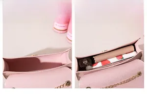 Pink pebbled leather crossbody bag interior showing phone and wallet storage space
