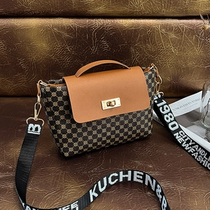 Vintage brown leather bucket bag with geometric prints and wide woven strap