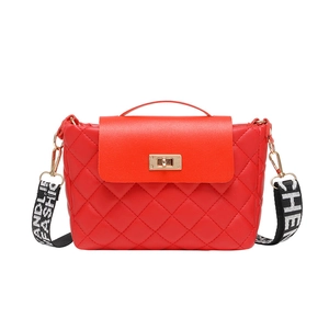 Red quilted shoulder bag with wide pattern fabric strap and golden buckle lock
