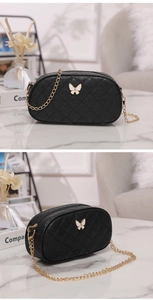 Détail du sac bandoulière ovale noir matelassé avec nœud blanc et chaîne dorée chic