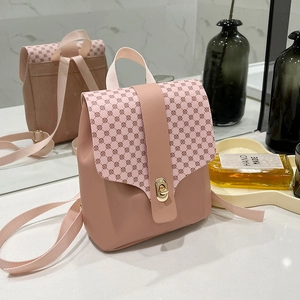 Mini pink leather crossbody phone bag with vintage geometric pattern and gold clasp