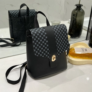 Mini black PU leather backpack for women with blue geometric print and gold twist lock