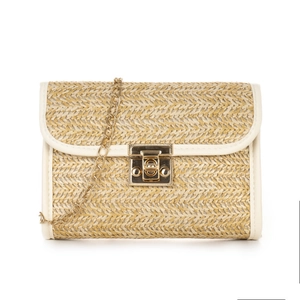 Woven straw crossbody bag with white leather trim and gold chain strap in white background