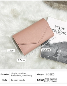 Detailed view of pink pebble leather crossbody bag with dimensions 16.5x10x2.5cm