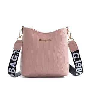 Pink crocodile pattern bucket bag with wide printed shoulder strap and metal logo