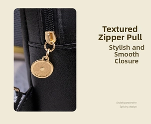 Detailed close-up of premium golden metal zipper and smooth black leather texture