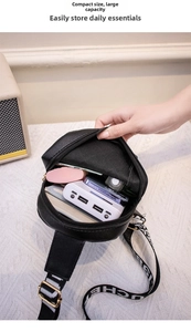 Interior view of black leather crossbody bag showing large capacity for daily items
