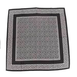 Elegant black and white Greek meander pattern silk square scarf shown in flat lay