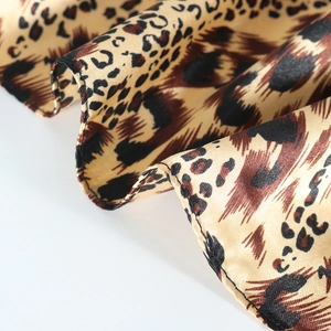 Satin leopard print square silk scarf with smooth texture and rolled edges
