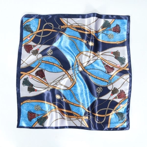 Detailed texture of 60cm silk square scarf featuring gold chain and floral motifs