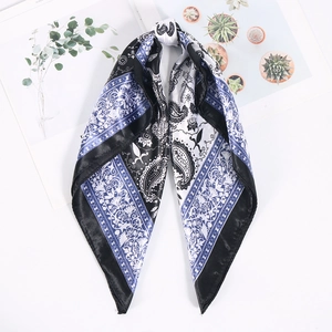 Detail of 60cm paisley print square silk scarf with floral patterns and black rolled edges