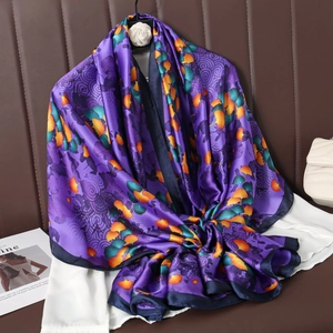 Purple silk scarf featuring yellow ginkgo leaf prints with elegant wavy patterns