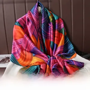 Detail of colorful striped silk scarf with satin finish draped over a white shirt