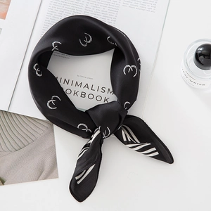 Elegant black silk-feel square scarf with white geometric print and luxury styling