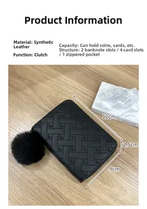 Close-up of heart quilted mini wallet with pompom charm and internal storage layout