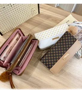 Detailed interior of women's long wallet showing multi-card slots and pink lining