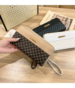 Detailed view of long zip wallets in classic textures with elegant gold metal nameplates